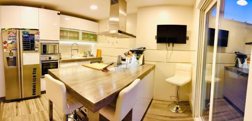 Chalet Familiar Jardín a 15 min centro y Warner gîte à louer El Piul