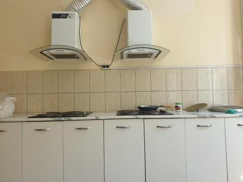 Kitchen, MILLIY Hostel in Jizzakh