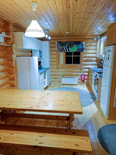 Cozy Log Cabin with Sauna and Wifi in มิวนิโอ