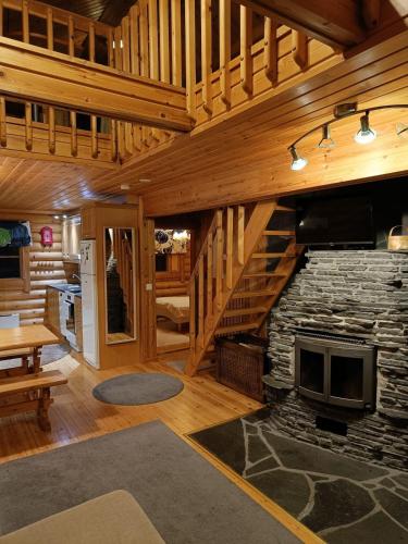 Cozy Log Cabin with Sauna and Wifi in มิวนิโอ