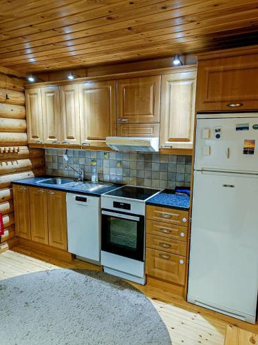 Cozy Log Cabin with Sauna and Wifi in มิวนิโอ