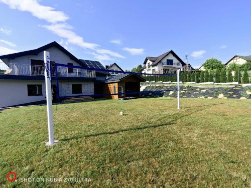 Exterior view of Zywiec Holidays - apartamenty i pokoje - Sauna - Game Room - Gry TV Play Station, bilard, lotki, pil