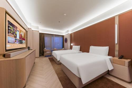 Twin Room room in Orange Crystal Qingdao Taitung Pedestrian Street Hotel