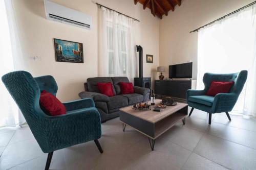 Közös társalgó / TV, Elite luxury Suites in Ómodosz