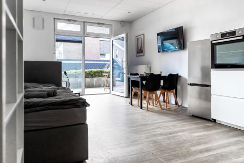 Apartment mit vier Einzelboxspringbetten - Netflix in กอช