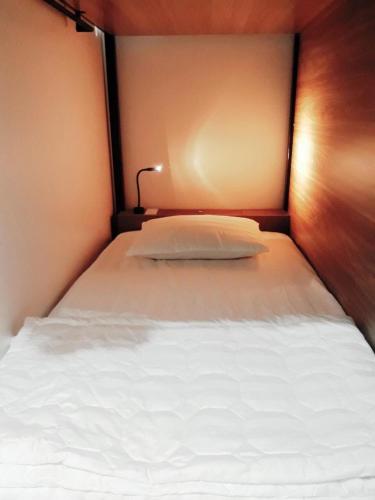 Single Bed in Dormitory Room room in Adora Central Park hostel with rooftop and floating market tour