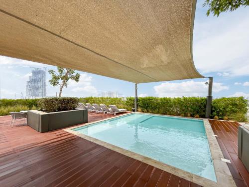 Swimming pool, Rustic Minimalist Home with Breathtaking Sea Views in Dubai Maritime City