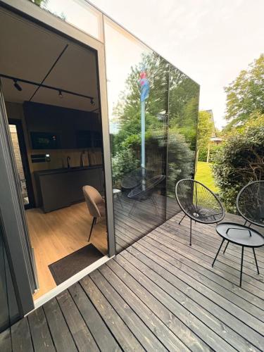 Spiegelhuisje aan zee in นิวฮัมสเตเดอ