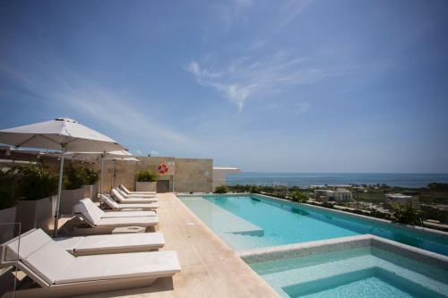 Luxurious 4BR condo by the beach - Rooftop pool, Cancún