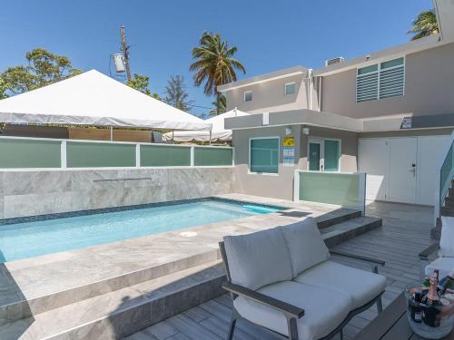 AQUA Terrazas Apt 6 - Beachfront Gem with Ocean Views & Pool in Dorado