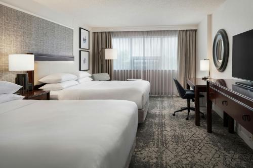 Queen Room with Two Queen Beds room in Sheraton Cavalier Calgary Hotel
