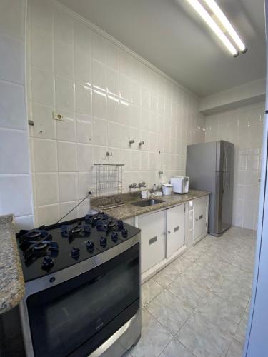Beachfront apartment on Pitangueiras Beach near Steam train pavillion