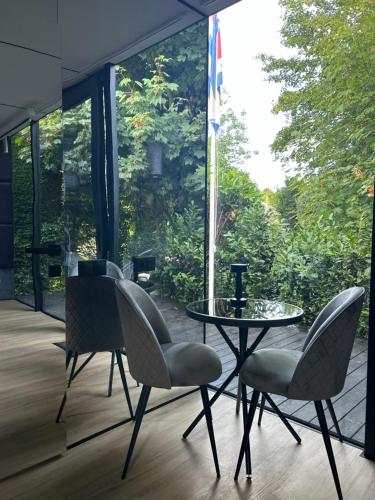 Spiegelhuisje aan zee in นิวฮัมสเตเดอ