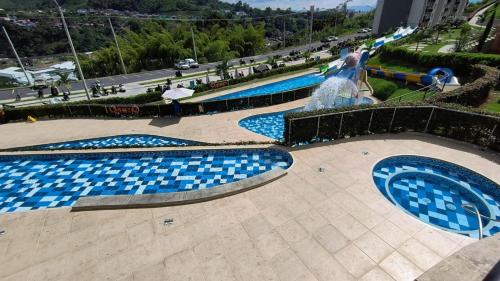 Swimming pool, Comodo Apartamento con parque acuatico Acqua Hills-6 personas in Oriente