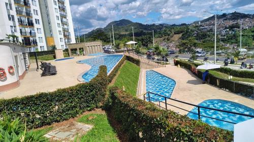 Swimming pool, Comodo Apartamento con parque acuatico Acqua Hills-6 personas in Oriente