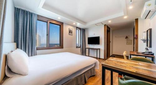 Check Inn Hotel Jeju - Tap to explore photos