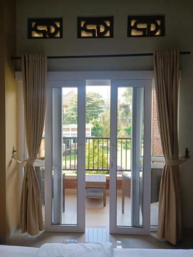 Urbanview Hotel Syariah Insani Cisarua Puncak Room Type - Deluxe Double Room