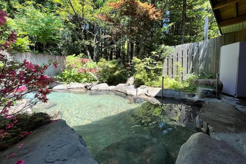 Open air bath, 湯の花ふわり 湯元館 in Chubu Sangaku National Park