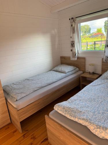 Domek z widokiem na jezioro in Kozlowo