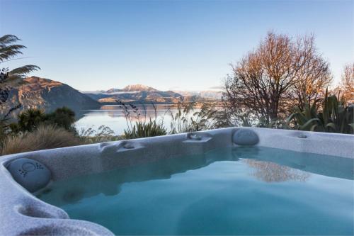 Strikingly designed in timber and glass in Glendhu Bay
