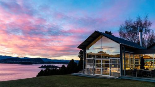 Strikingly designed in timber and glass in Glendhu Bay
