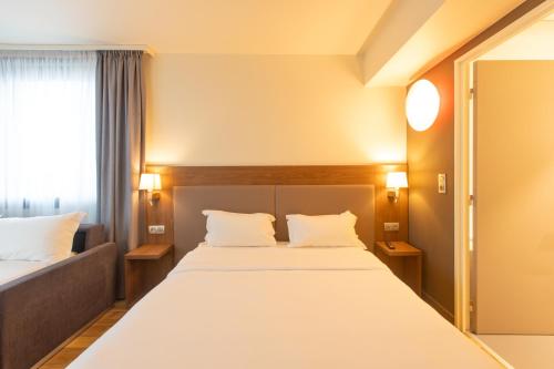 Quadruple Room with One Sofa Bed and One Double Bed