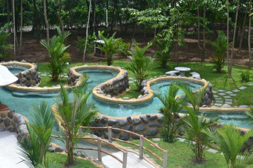 Hot spring bath, Volcano Lodge, Hotel & Thermal Experience in La Fortuna