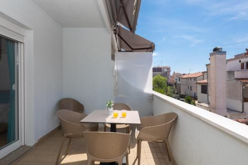 One-Bedroom Apartment with Balcony room in Magnolia Center Apartments 1