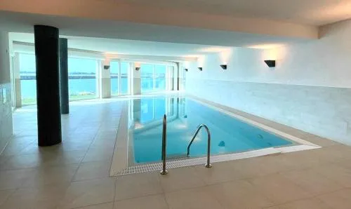 Ferienwohnung direkt am Meer mit Pool und Sauna, Strand fußläufig erreichbar, barrierefrei in Kappeln, Deutschland