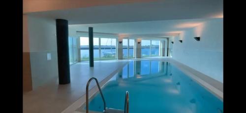Swimming pool, Ferienwohnung direkt am Meer mit Pool und Sauna, Strand fußlaufig erreichbar, barrierefrei in Olpenitz