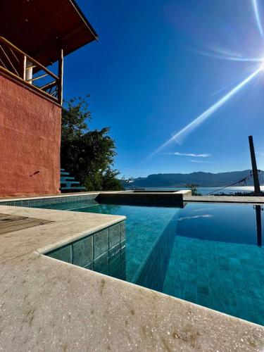 สภาพแวดล้อมโดยรอบ, Jacuzzi e Piscina com Borda Infinita e Vista Incrível para o Mar (Jacuzzi e Piscina com Borda Infinita e Vista Incrivel para o Mar) in หาดอิตากวันดูบา