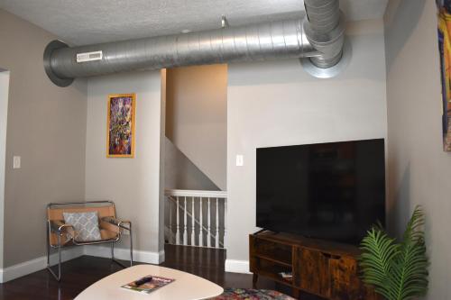 Urban Oasis 4BR Industrial Apartment thumb 2
