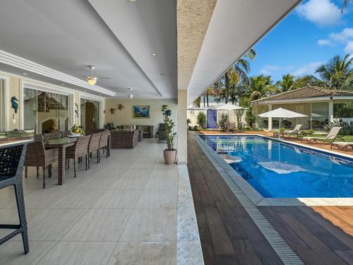 泳池, Mansão com 5 suites Piscina Churrasqueira Ar condicionado (Mansao com 5 suites Piscina Churrasqueira Ar condicionado) in 雅爾丁阿卡普爾科