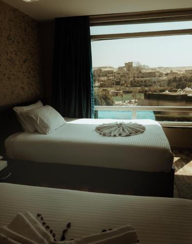 Turquoise Pyramids & Grand Egyptian museum view Hotel - image 14