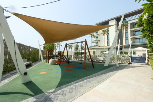 Playground, High-end Beachfront 4BR Duplex with Patio Sea and Burj View in Pearl Jumeirah
