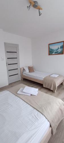 Pokoje i Apartamenty Ara Karwia