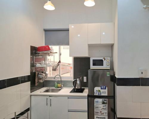 kuchnia, Saigon Apartments 2 in Dzielnica 8.