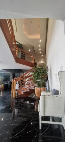 Lobby, Belvilla Cozy Stays Near Airport Formerly Boss Hotel near Sacred Heart Medical Center