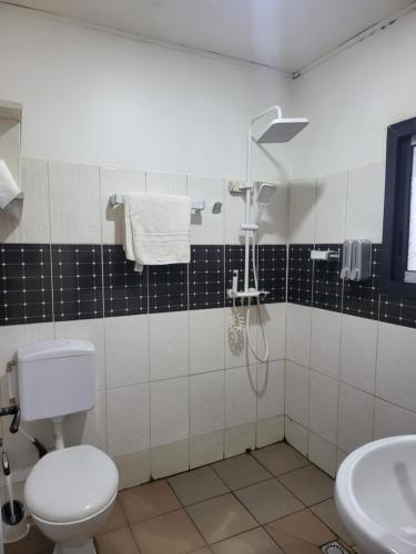Bathroom, Ndouha House in Bafoussam