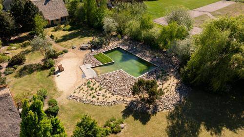Reetdachhaus mit Schwimmteich in Krienke - barrierefrei, Sauna & Kamin in Rankwitz, Deutschland