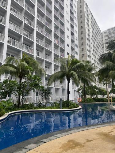 staycation condo one bedroom balcony w pool view near SMX SM MOA IKEA NAIA DFA OCEAN PARK, Manila