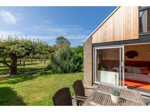 Garden, Holiday Home in De Punt with Pool  Garden in Hogeweg