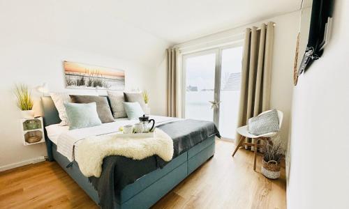 Surfbude, Olpenitz - moderne Ferienwohnung in direkter Strandnahe mit eigenem Eingang, Sauna, Kamino in Olpenitz