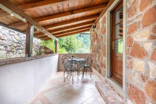 Balkons/terase, Villa Soli - Casa in Pietra con Piscina Panoramica in Villa Collemandina