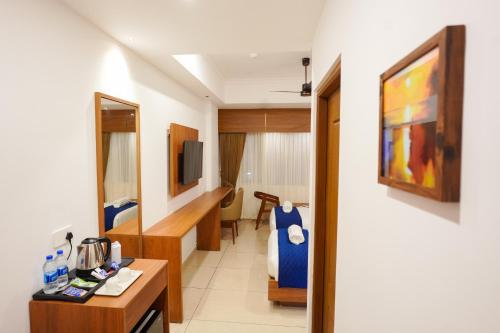 Hotel Praada Residency in โกทามังคาลาม