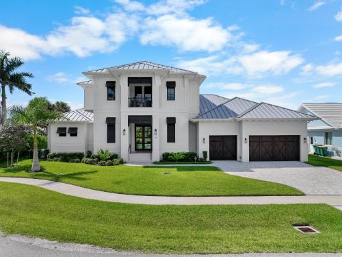 Opulent custom waterfront home with heated pool and spa