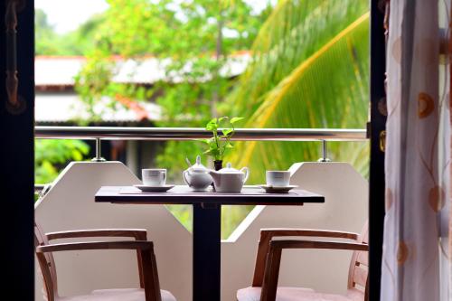 balkon/terras, L&D Lodge in Hikkaduwa