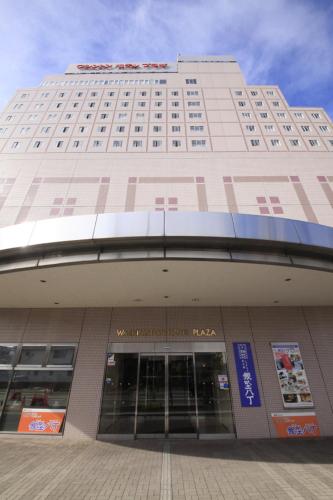 a large building with a sign on the side of it, Kofu Washington Hotel Plaza in Kofu