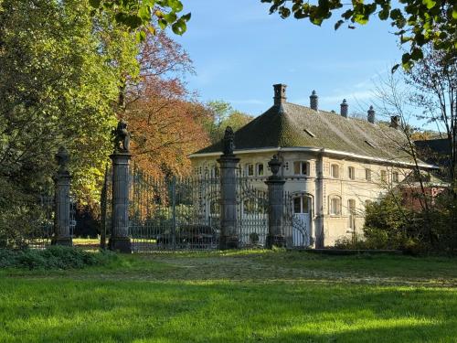 Logies Het Koetshuis chambre d'hôte Oosterwijk