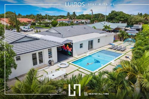 Exterior view, Luxury 7BR Retreat with Games, Pool & Mini Golf L68 in Kendale Lakes